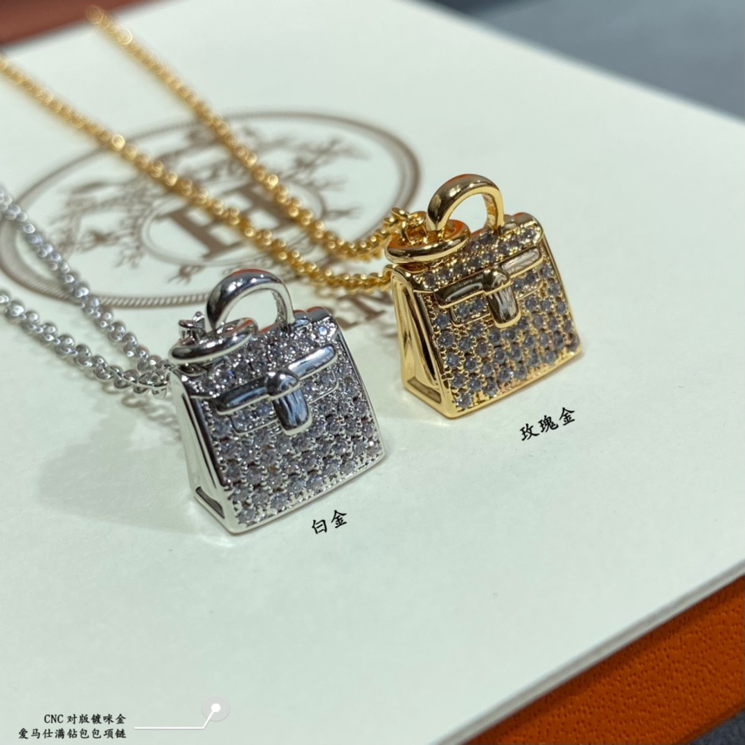 hermès fully Di*m*nd-encrusted bag necklace