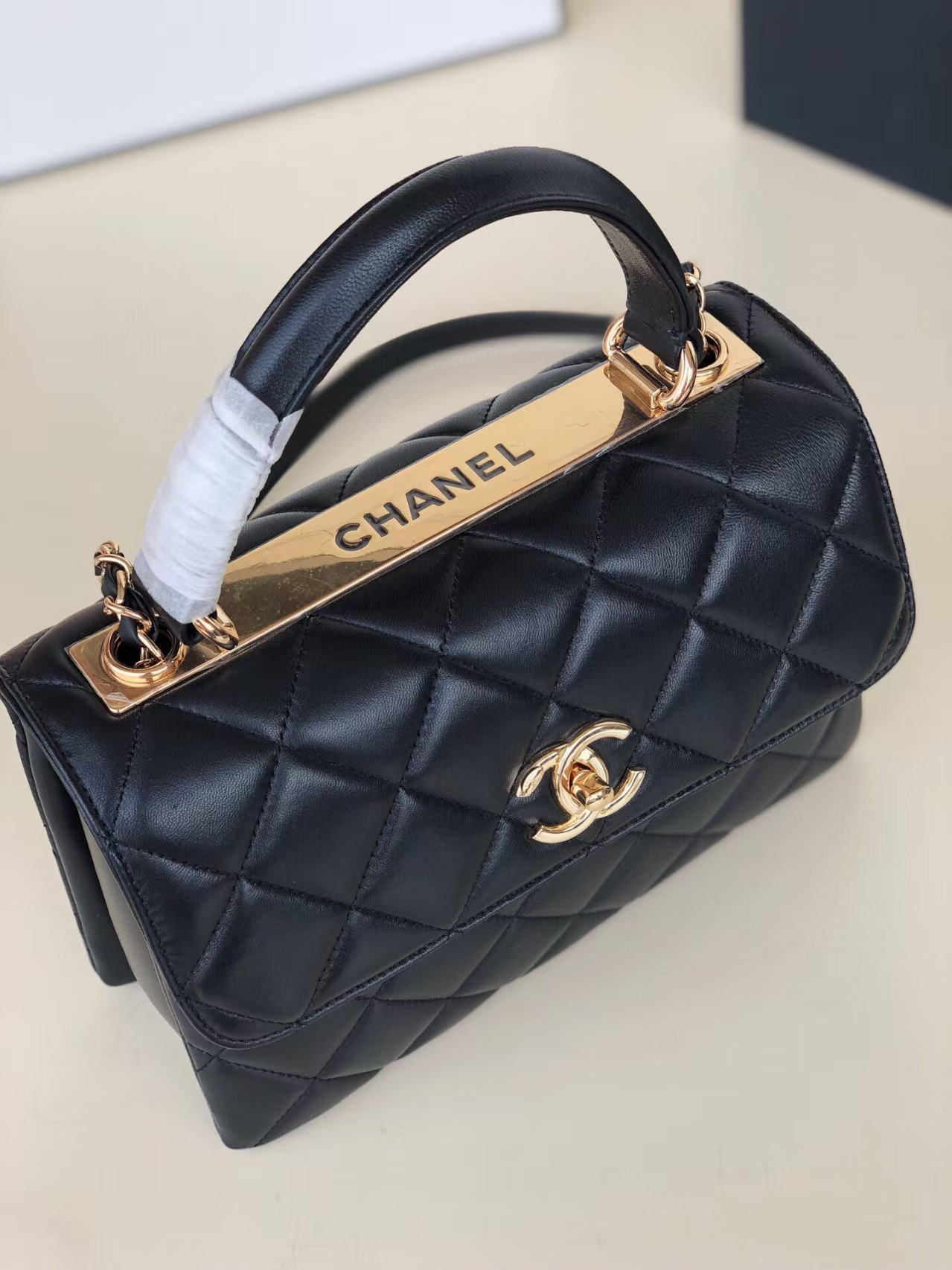 Ch*el flap bag with top handle 6.6 × 9.8 × 4.7 in